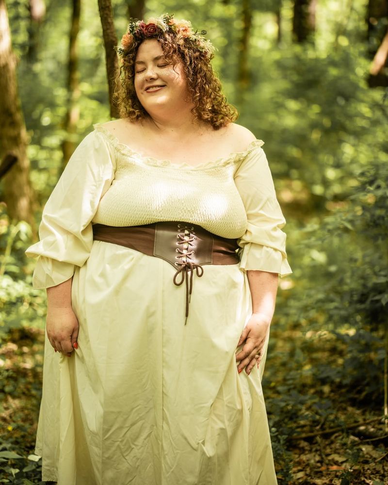 Jessica in a flower crown and cream dress in the woods